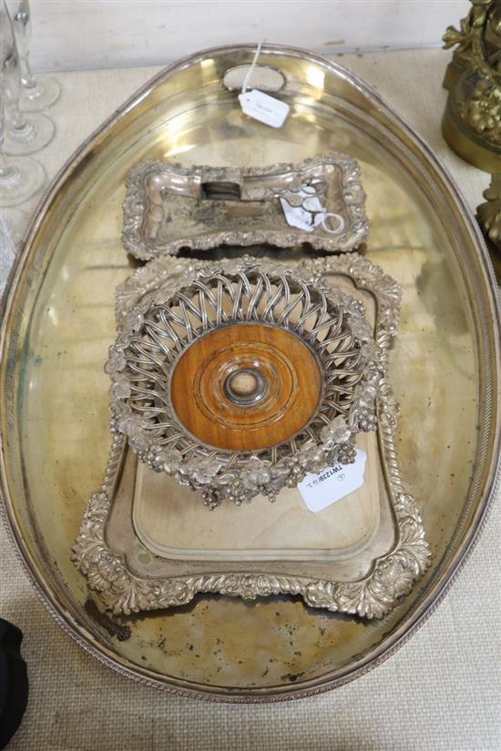 A pair of plated bottle coasters, an oval tray and three other plated items